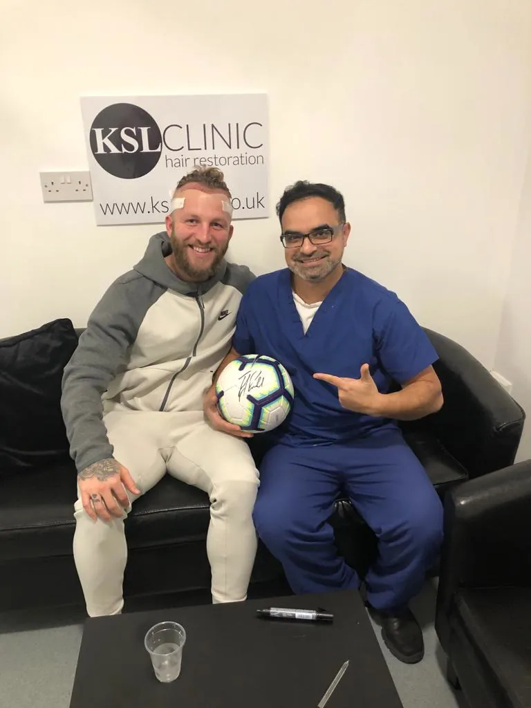 Dr Matee with a patient at KSL Clinic after his consultation
