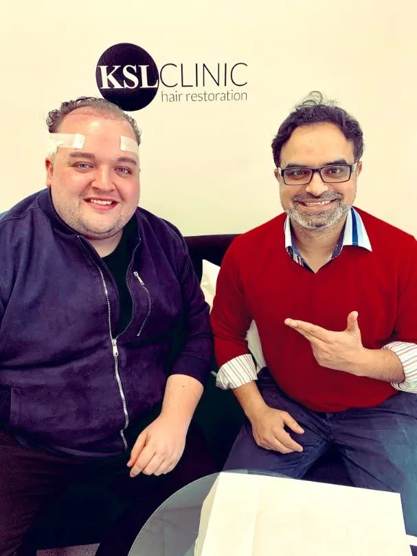 Dr Matee with a patient at KSL Clinic