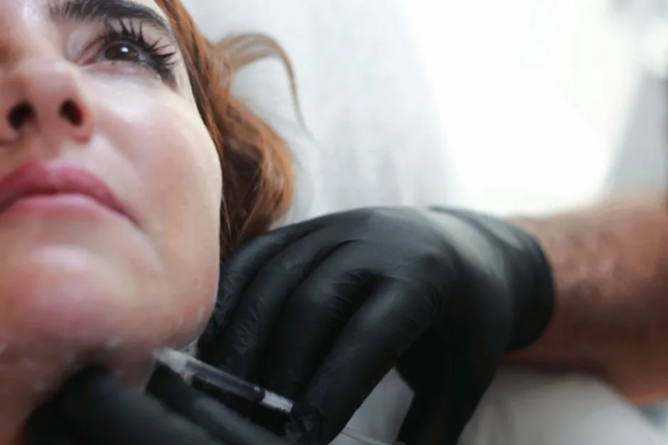A dermal filler injection being administered in a clinic setting