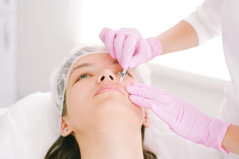A facial injection being administered in a clinical setting
