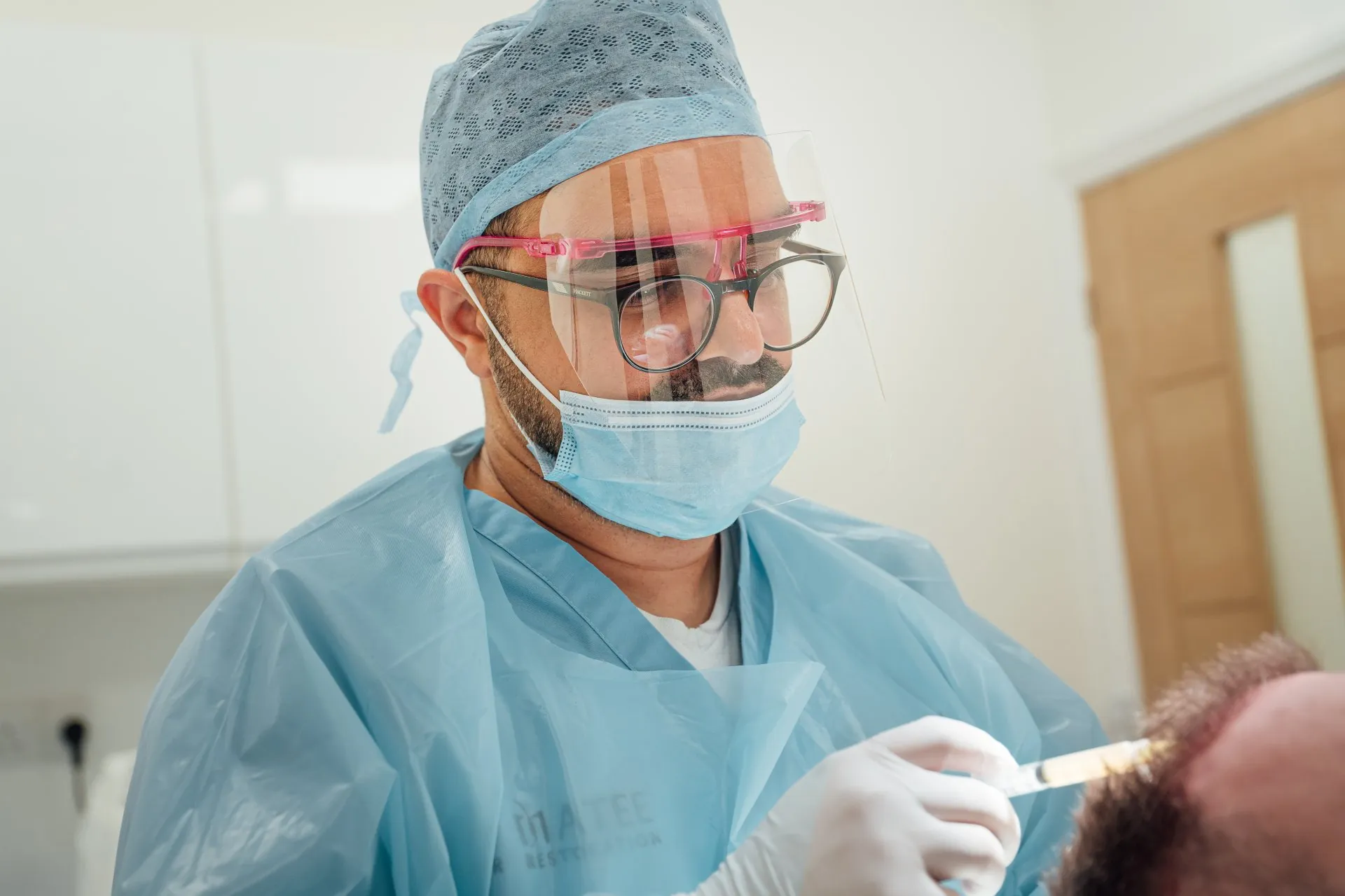 Dr Matee operating at the Kent clinic