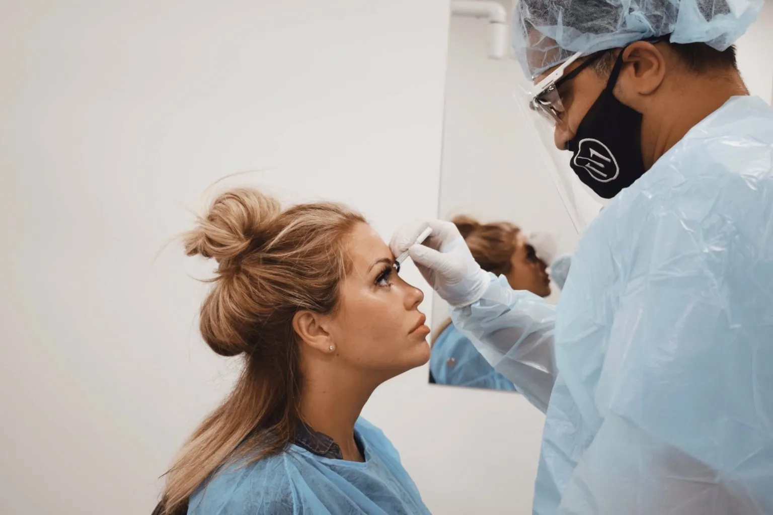 Dr Matee planning an eyebrow transplant